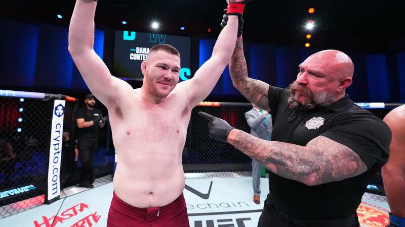 LAS VEGAS, NEVADA - AUGUST 23: (R-L) Eduardo Neves of Brazil punches Mick Parkin of England in a heavyweight fight during Dana White
