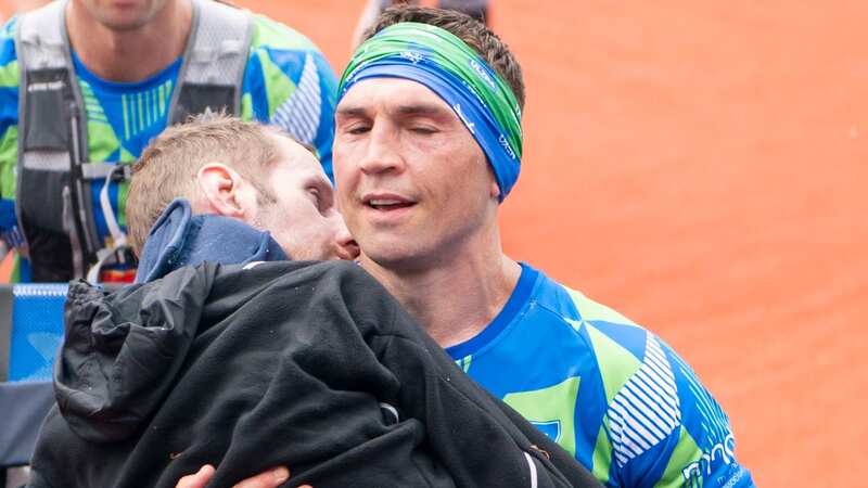 Kevin carries Rob over the line (Image: PA)