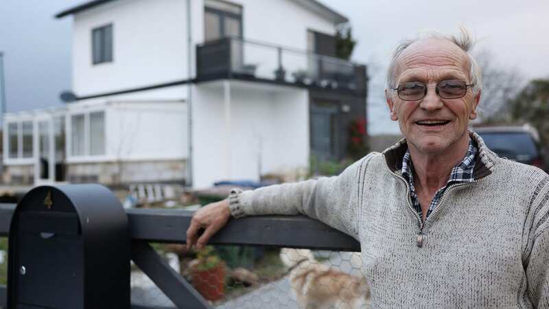 Malcolm Hughlock, 70, in front of the property in Boosbeck (Image: Copyright Unknown)