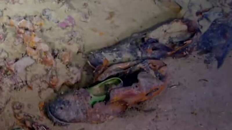 Haunting images show a pair of shoes in the Titanic wreck (Image: ATLANTIC PRODUCTIONS/MAGELLAN)