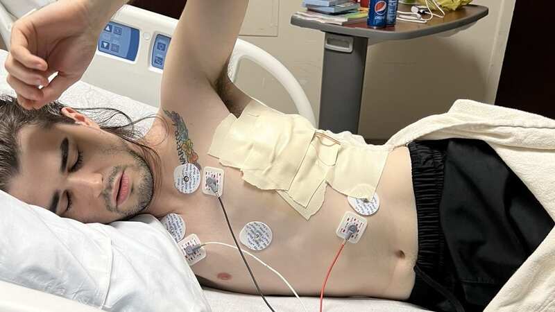 Jonathan Belcher lies recovering in a hopsital bed (Image: Kennedy News/Jonathan Belcher)