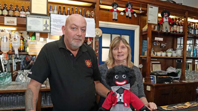 Chris and Benice Ryley with a golly doll at the White Hart in Grays, Essex (Image: Eastnews Press Agency)