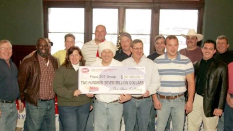 Scott Bradley with the group of 14 co-workers who shared the massive jackpot (Image: 10TV / WBNS)