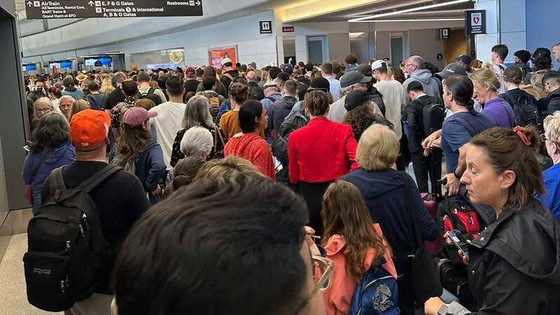 Crowds throng in the San Francisco Terminal as emergency services move people away