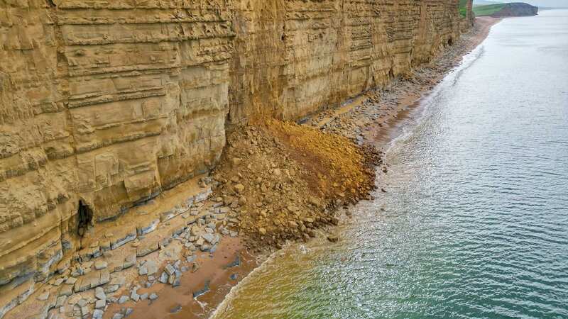 Coastguards received a flurry of 999 calls from members of the public and fishermen after the cliff at Broadchurch beach gave way (Image: Graham Hunt/BNPS)