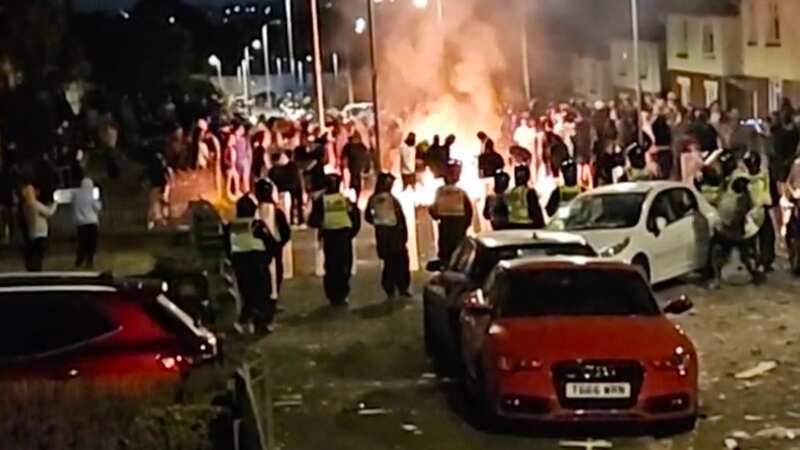 Crowd clash with police after two teens die with fires lit and fireworks thrown