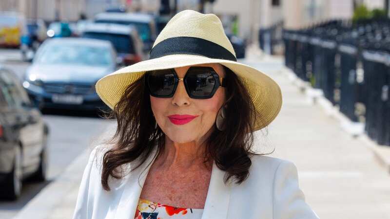 Joan Collins stuns on 90th birthday as she poses for snaps in signature style