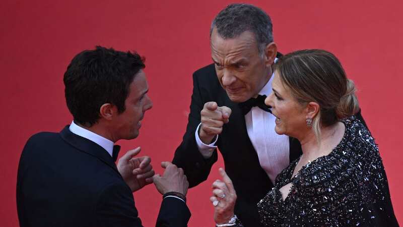 Tom Hanks and Rita Wilson appeared to scold the staff member (Image: AFP via Getty Images)