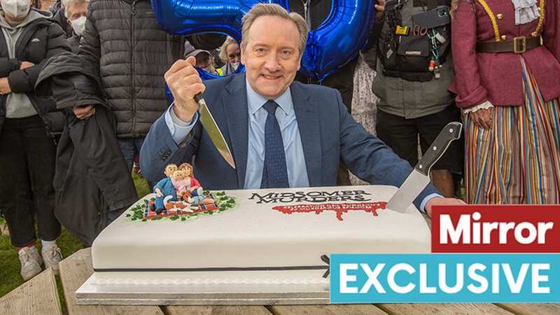 Neil Dudgeon cuts cake to mark his 50th episode of show (Image: mark bourdillon)
