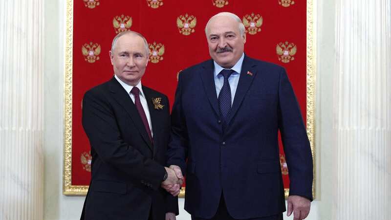 Russian President Vladimir Putin greets Belarus
