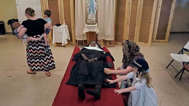 Visitors come to pay their respects to the body of Sister Wilhelmina Lancaster (Image: AP)