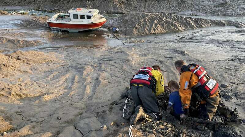 Coastguards freed the boy after he sank up to his waist in the mud (Image: Clevedon Firefighters / SWNS)