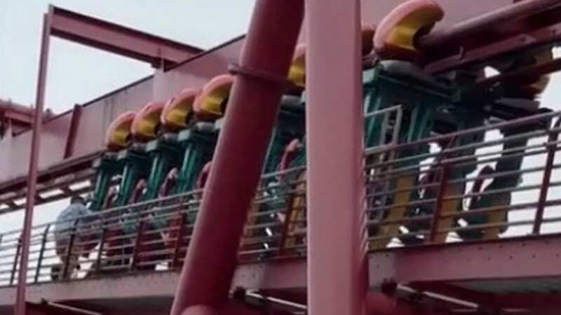 Terrified riders dangle mid-air as roller coaster stops to let one person off