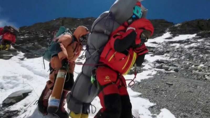 Nepali guide Gelje Sherpa carrying the unnamed tourist (Image: BBC)