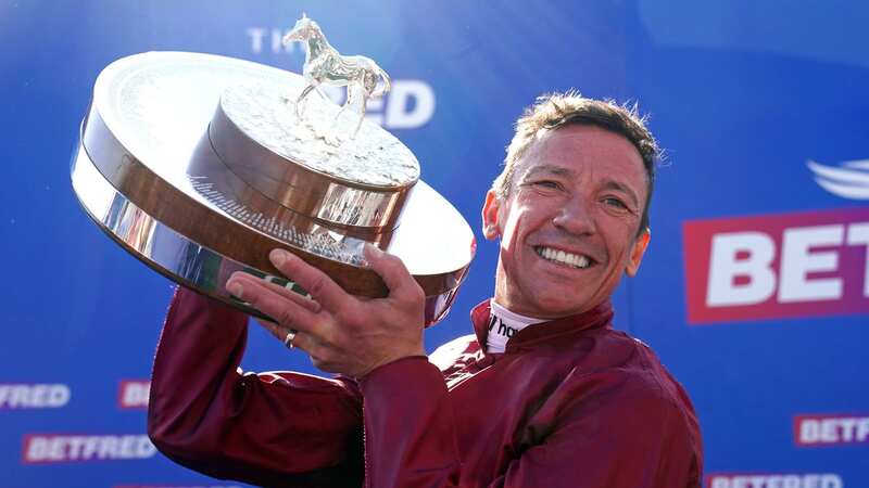 Frankie Dettori celebrates with the trophy (Image: PA)