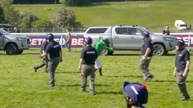 Jockey Oisin Murphy hurls his whip to the ground at Epsom (Image: ITV)