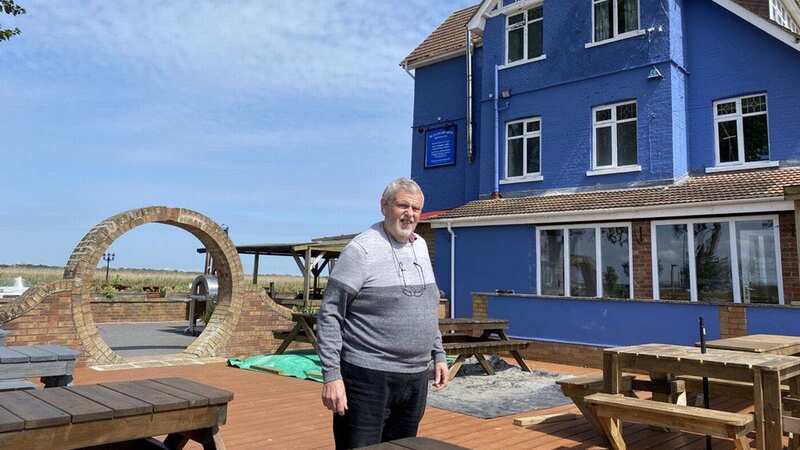 Raymond Hollocks, pictured in front of Beauchamp Arms, has been embroiled in a 25-year-long planning feud (Image: Bruno Brown / SWNS)