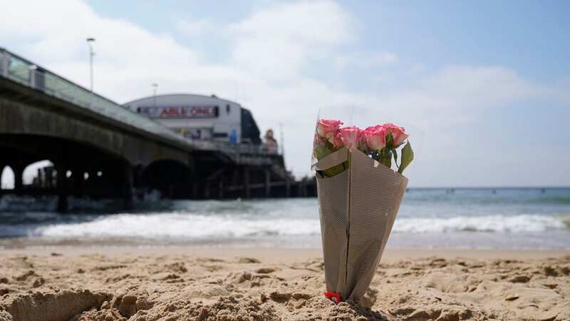 Floral tributes have been left at the beach after two children died earlier this week (Image: PA)