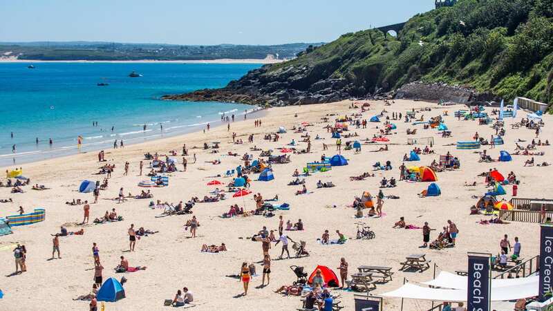 Crowds gather to enjoy the weather at the Porthminster beach in St Ives, Cornwall (Image: SWNS)