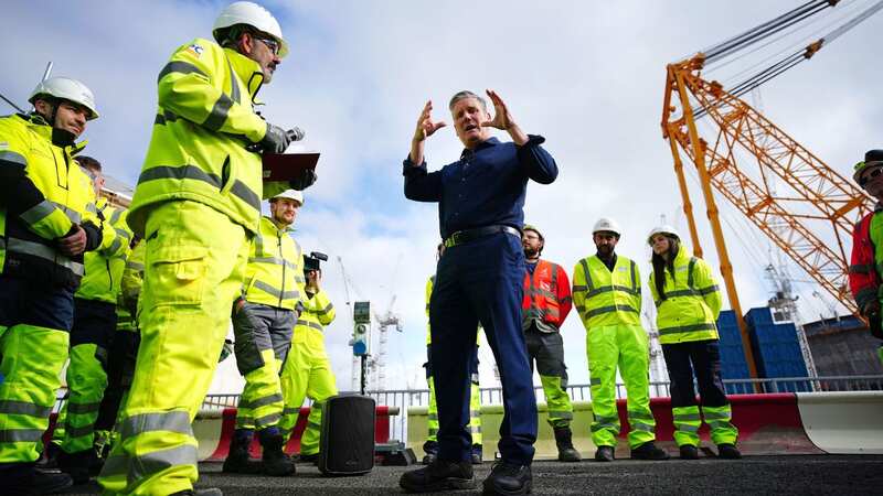 Keir Starmer talks to workers during a visit to Hinkley Point nuclear power station in Somerset (Image: PA)