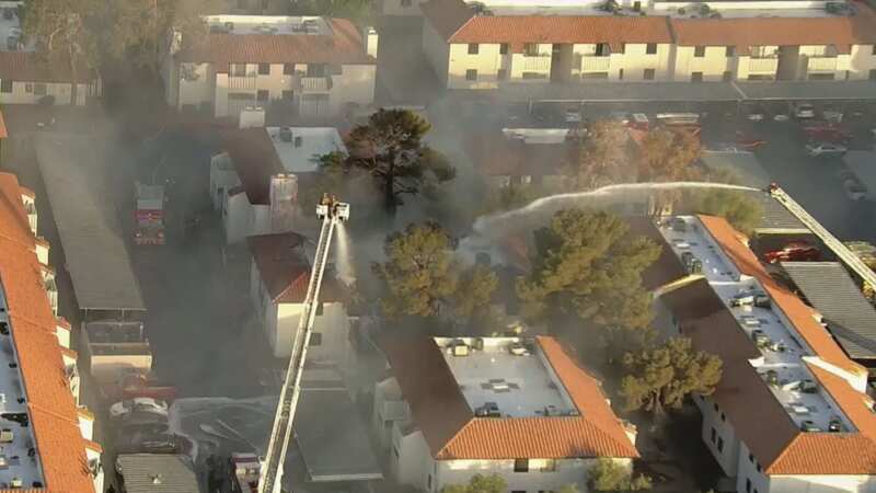 Fire rips through apartment building as huge plumes of smoke circle area