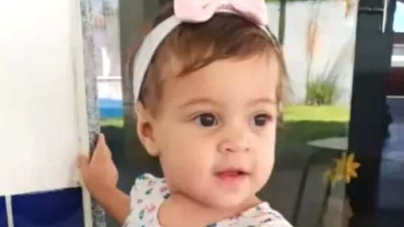 The baby girl, seen smiling in photographs with a ribbon in her hair