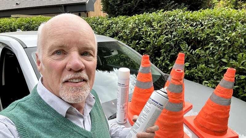 Peter with his spray paint and cones (Image: Peter Sharratt / SWNS)