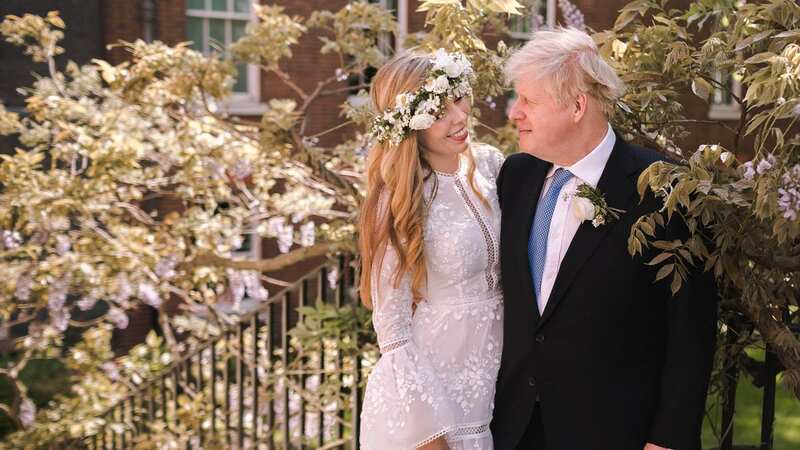 Boris Johnson with his wife Carrie Johnson (Image: Downing Street via Getty Images)