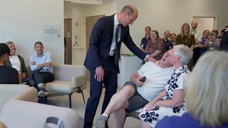 William shares a joke with a man at the Oak Cancer Centre (Image: PA)