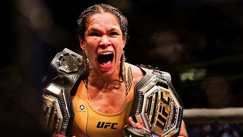 Amanda Nunes celebrates with her two belts (Image: Getty Images)