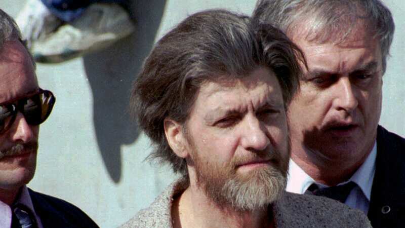 Ted Kaczynski, better known as the Unabomber, flanked by federal agents in 1996 (Image: AP)