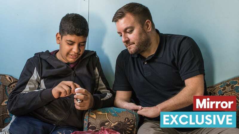 Alex Brooker visits Syrian refugee 14-year-old Hamza Harb, at the The Zaatari refugee camp in Jordan