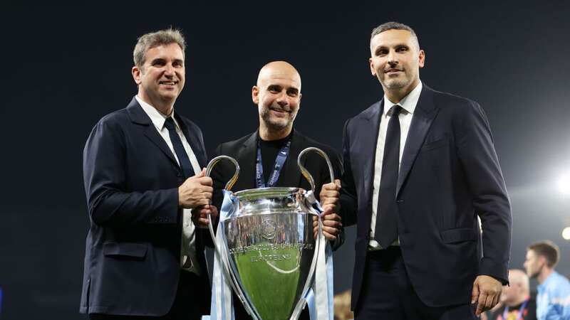 Pep Guardiola lifts the Champions League trophy with chief executive Ferran Soriano and chairman Khaldoon Al Mubarak.