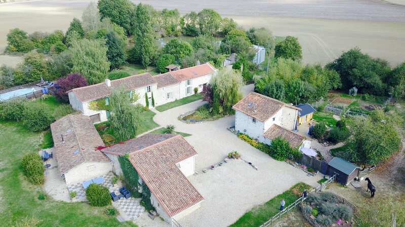 A Manchester family sold their three-bed home for £400,000 and used the cash to buy six 400-year-old houses, two barns and three-acres of land in France (Image: David Murphy / SWNS)