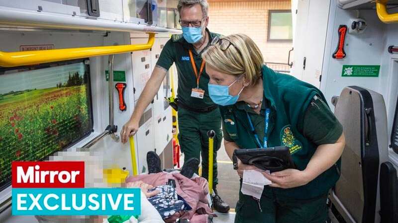 Paramedics collecting woman with chest pain (Image: Rowan Griffiths / Daily Mirror)