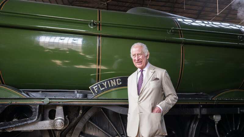 The King poses with the Flying Scotsman (Image: PA)