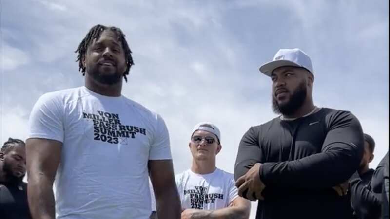 Cam Jordan (left) speaks at Pass Rush summit.