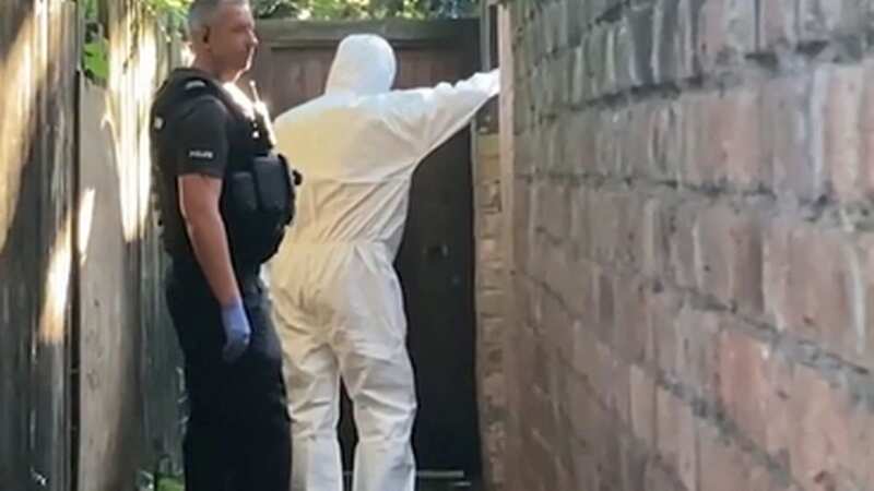Nottingham police and forensics search back of raided home after three killed