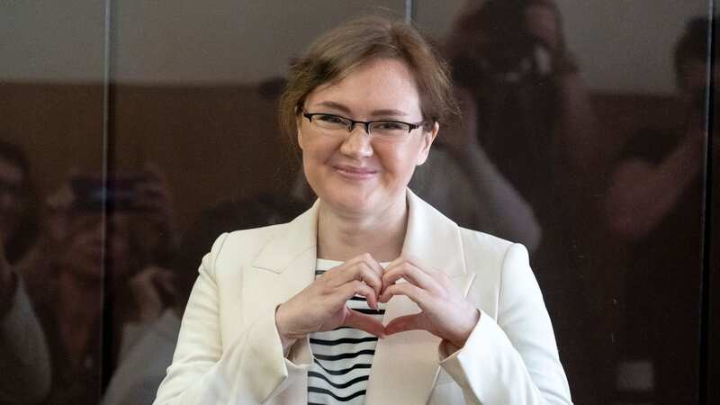 Lilia Chanysheva makes a heart gesture as she stands in the dock in Ufa, Russia on June 14 2023 (Image: AP)