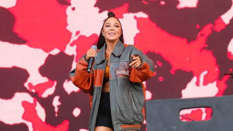 Tulisa dropped a piece of jewellery at The Isle of Wight Festival (Image: Dawn Fletcher-Park/SOPA Images/REX/Shutterstock)