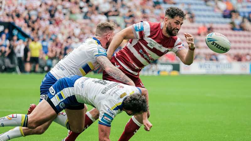 Wigan loanee Toby King against his Warrington team-mates Daryl Clark and Stefan Ratchford (Image: Alex Whitehead/SWpix.com)