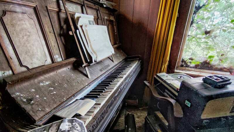 An old piano with broken keys sits inside the property (Image: mediadrumimages / Adam Corkill)