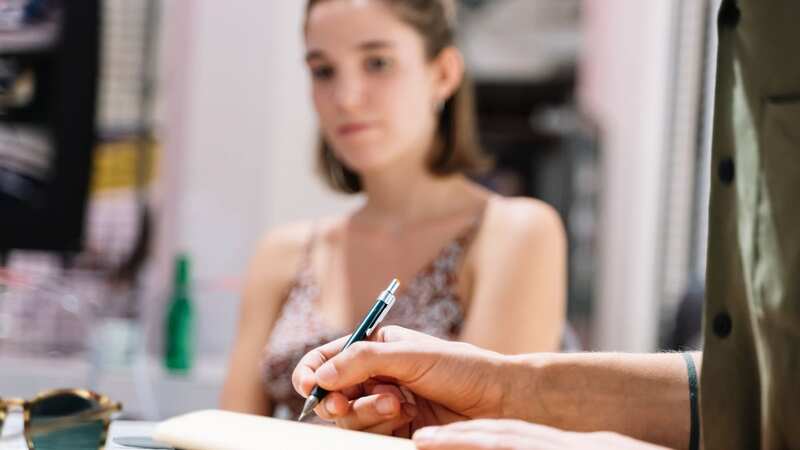 The woman was furious when she received the review (stock photo) (Image: Getty Images)
