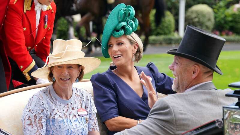 Zara looked stylish in a navy dress with vibrant green hat (Image: Chris Jackson/Getty Images)