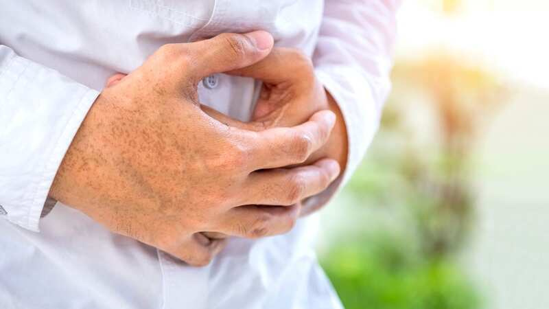 A dull or aching pain in the top right of the tummy could be one symptoms of fatty liver disease (Image: Getty Images)