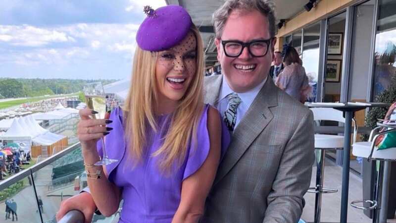 Amanda Holden and Alan Carr pose at the Ascot Races with matching purple outfits (Image: Instagram)