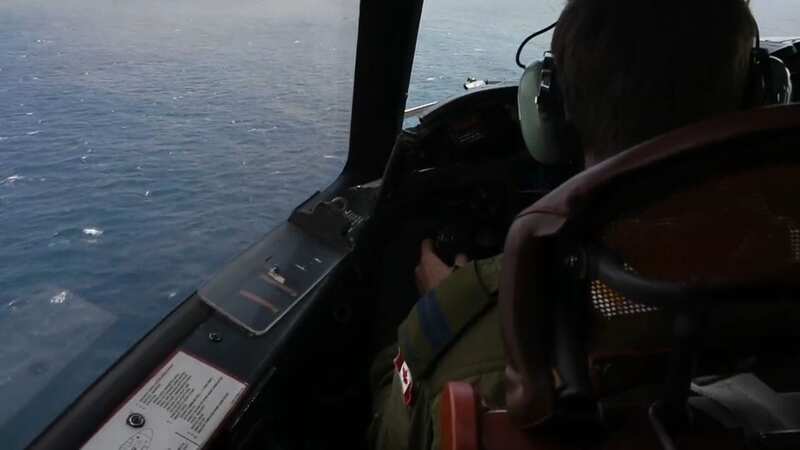 Searchers release video of plane surveying Titanic sub area as forecasters warn worsening weather will hamper recuse efforts (Image: @CFOperations/Twitter)