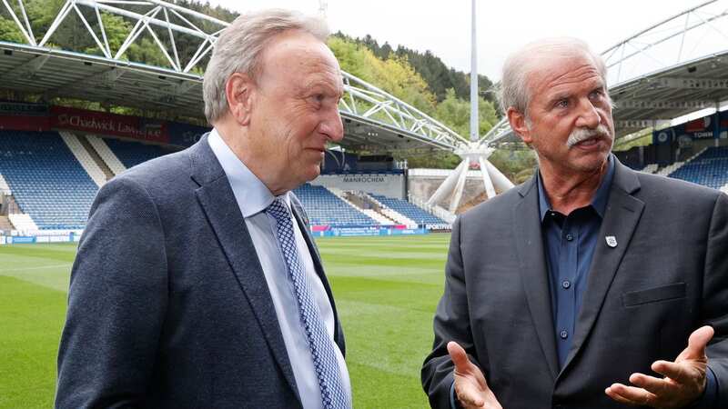 New Huddersfield Town owner Kevin Nagle chats with club manager Neil Warnock prior to buying the Yorkshire club. (Image: John Early/Getty Images)