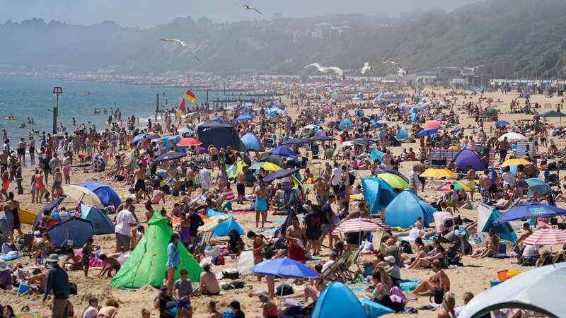 People enjoying the warm weather on Bournemouth beach in Dorset yesterday (Image: PA)