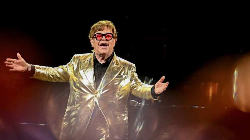 Elton John fans hit out at Piers Morgan after he accused the singer of reading his own lyrics from a sheet during his Glastonbury performance (Image: Leon Neal/Getty Images)